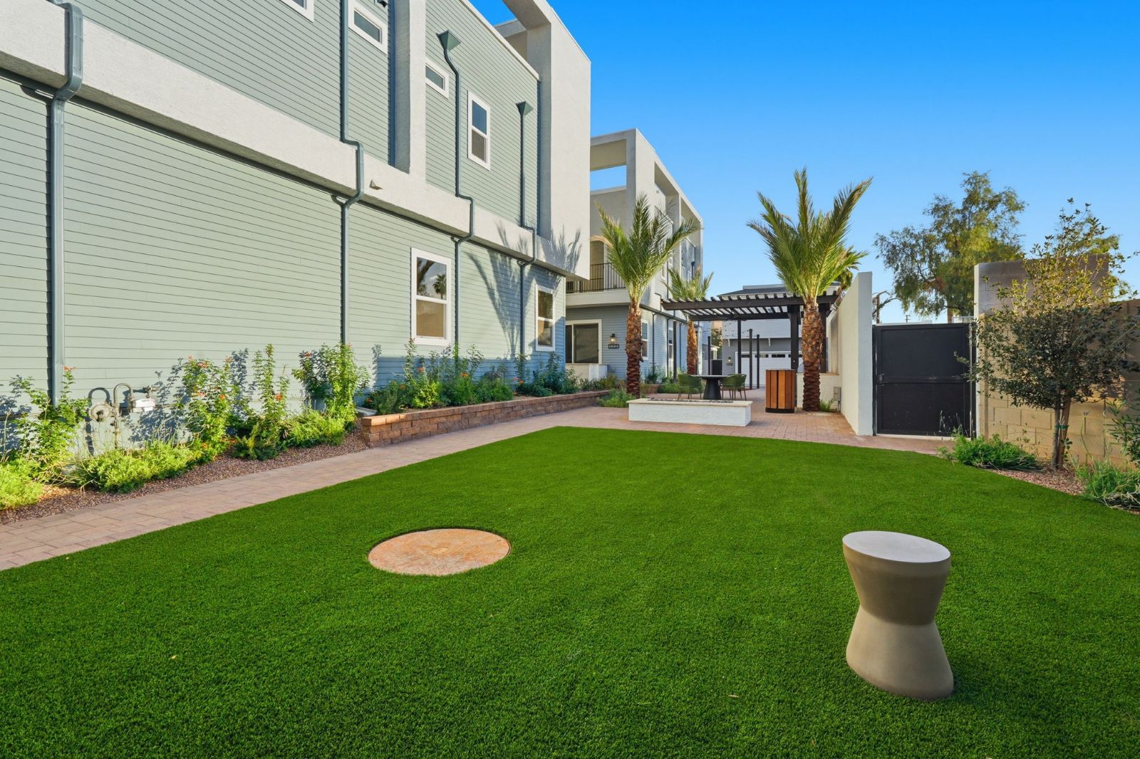 Corn-hole lawn on the paseo — gated community paseo at The Bower Willo, Phoenix AZ 85003