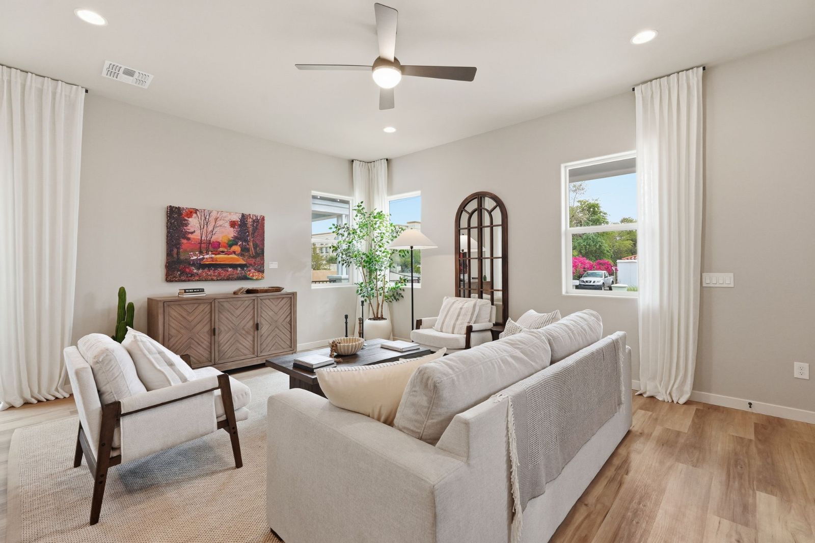 Open great room with solid-surface GemCore flooring, quartz finishes and curated lighting package — Heritage Home model at 113 W Willo Ct, The Bower Willo, Willo Historic District, Phoenix AZ 85003